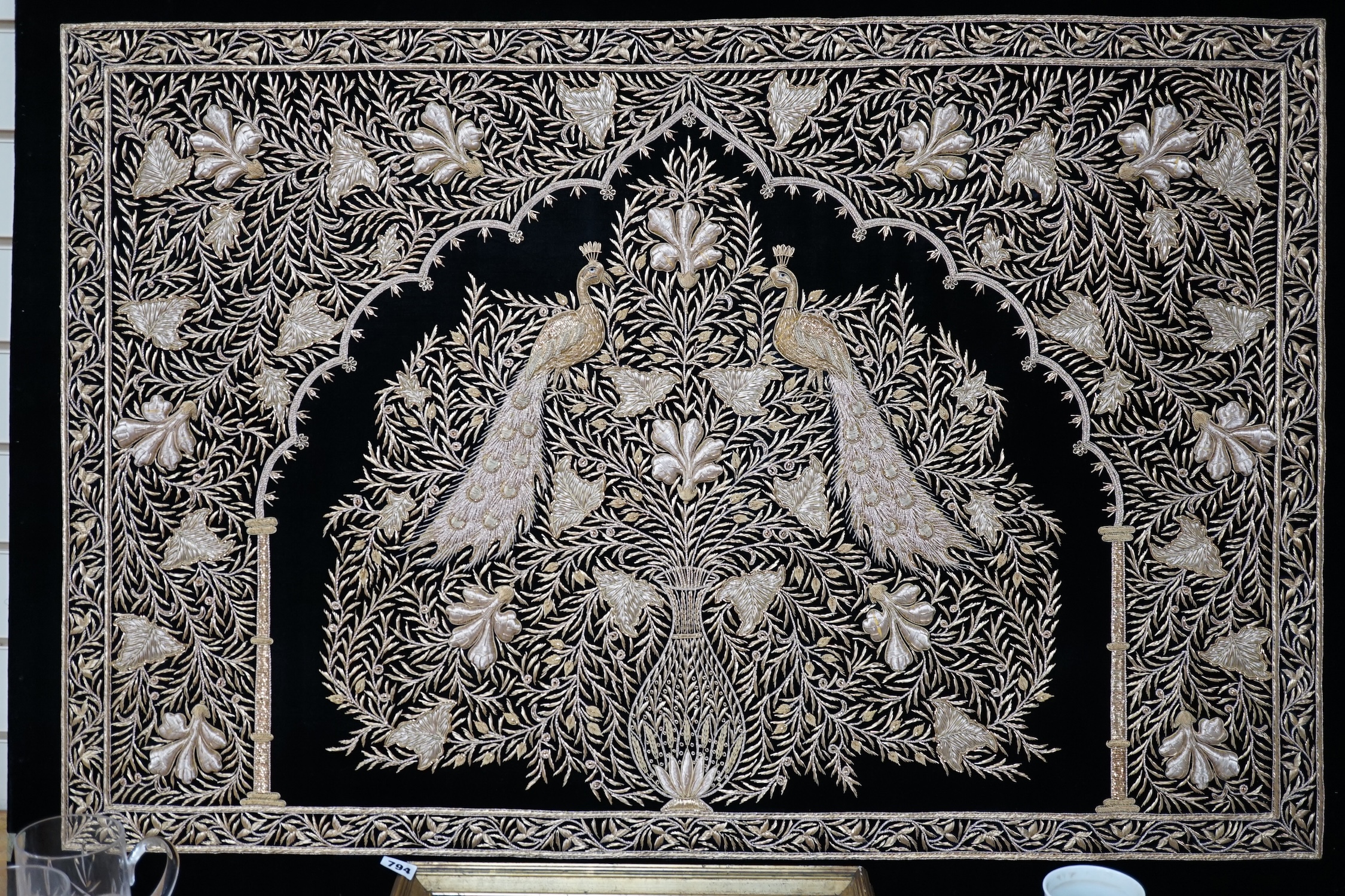 An Indian velvet and gold bullion work panel depicting two peacocks, 85 x 122cm. Condition - good
